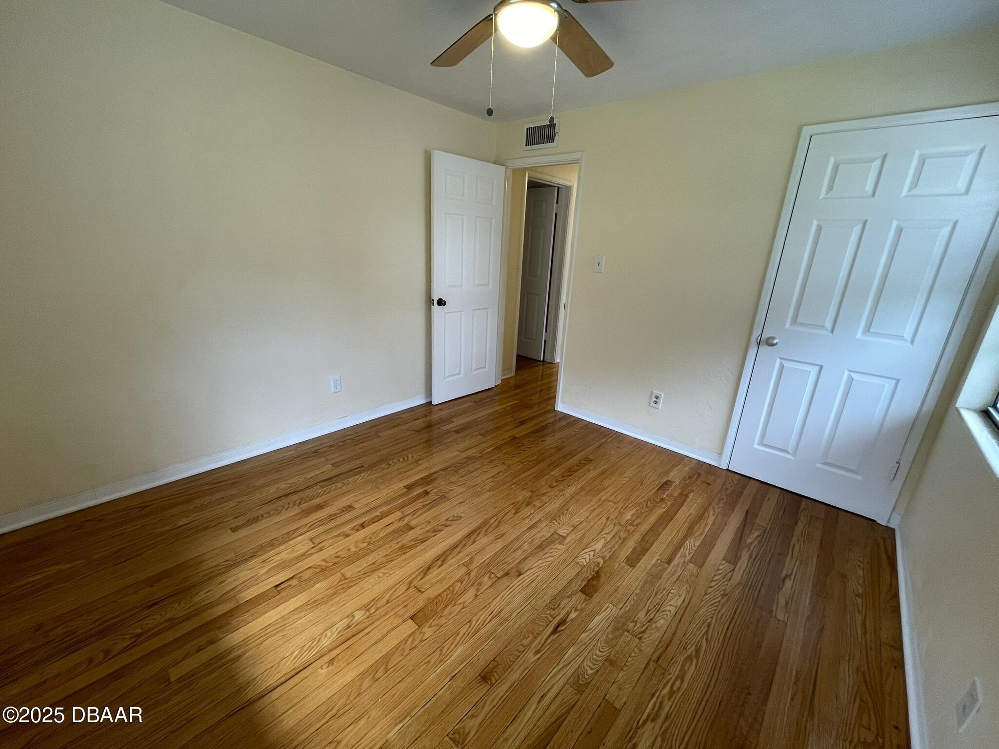 525 Tarragona Way Daytona Beach, FL 32114 - Photo 39 of 47 a view of empty room with wooden floor