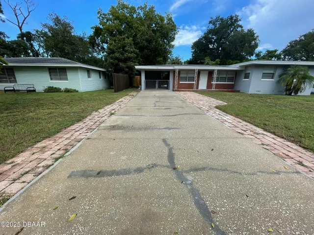 a house view with a garden space