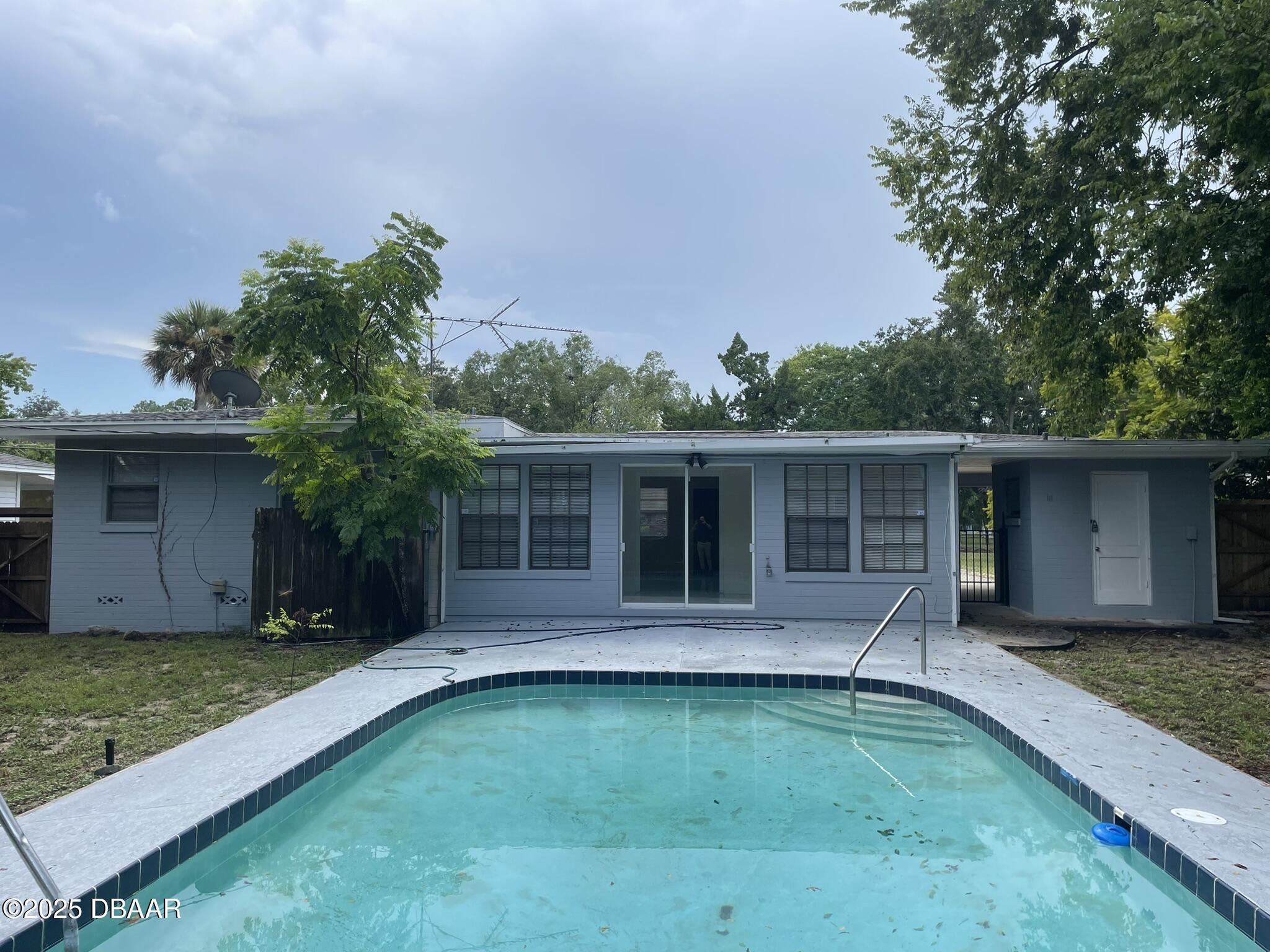 525 Tarragona Way Daytona Beach, FL 32114 - Photo 7 of 47 front view of a house with a yard