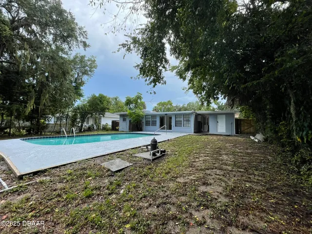 a house with trees in the background