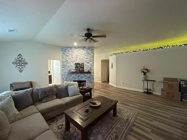 a living room with furniture and a table