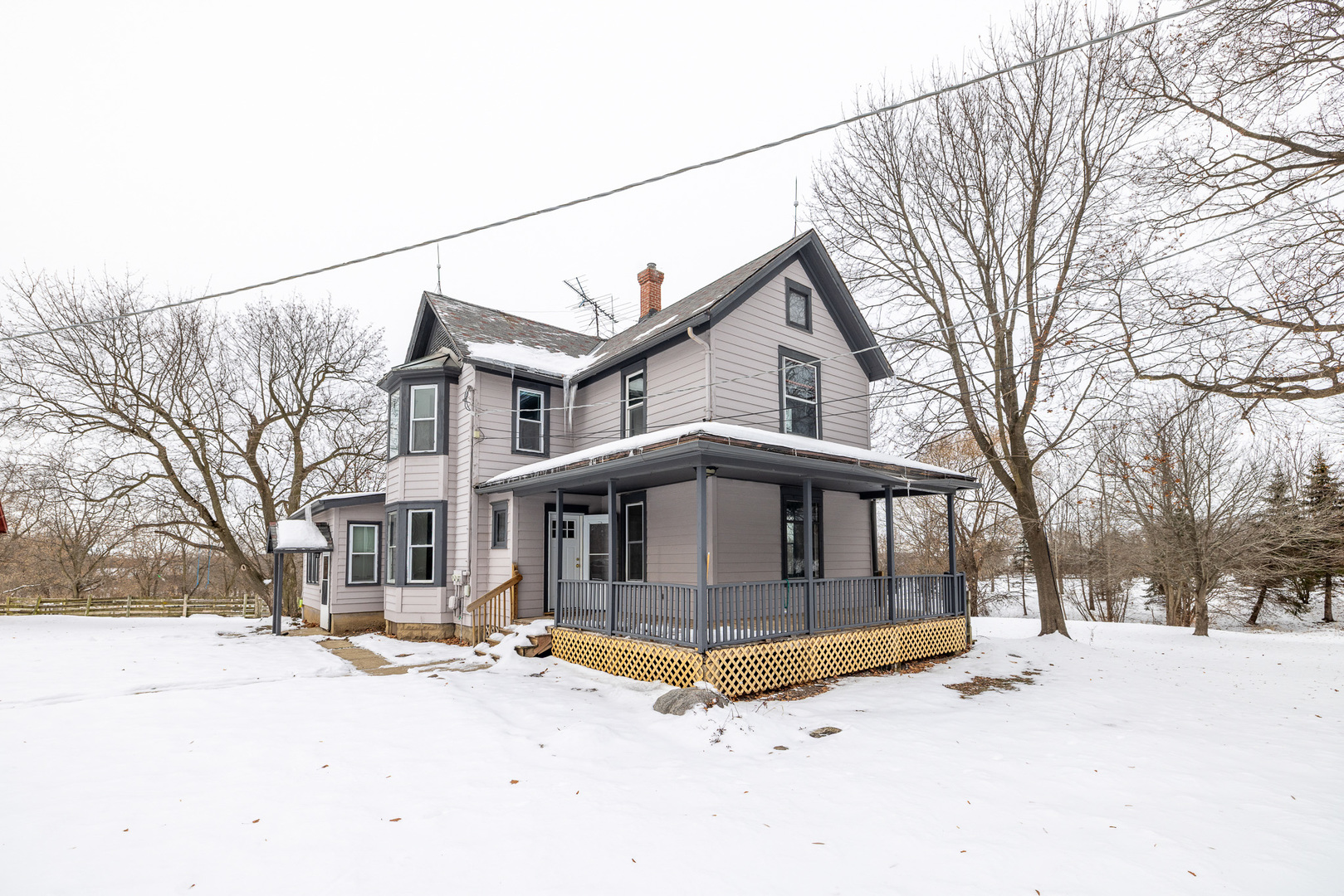39520 North Kilbourne Road Wadsworth, IL 60083 - Photo 2 of 44 a view of a house with a yard covered in snow