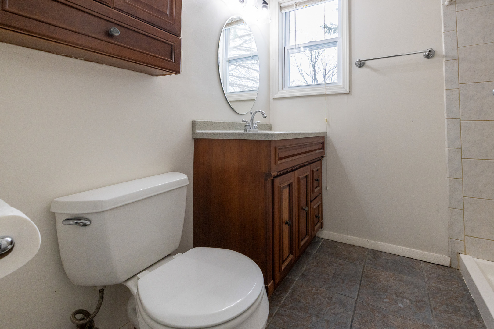 39520 North Kilbourne Road Wadsworth, IL 60083 - Photo 24 of 44 a bathroom with a toilet a sink and a mirror
