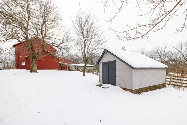 a view of swimming pool with outdoor seating and yard in the back