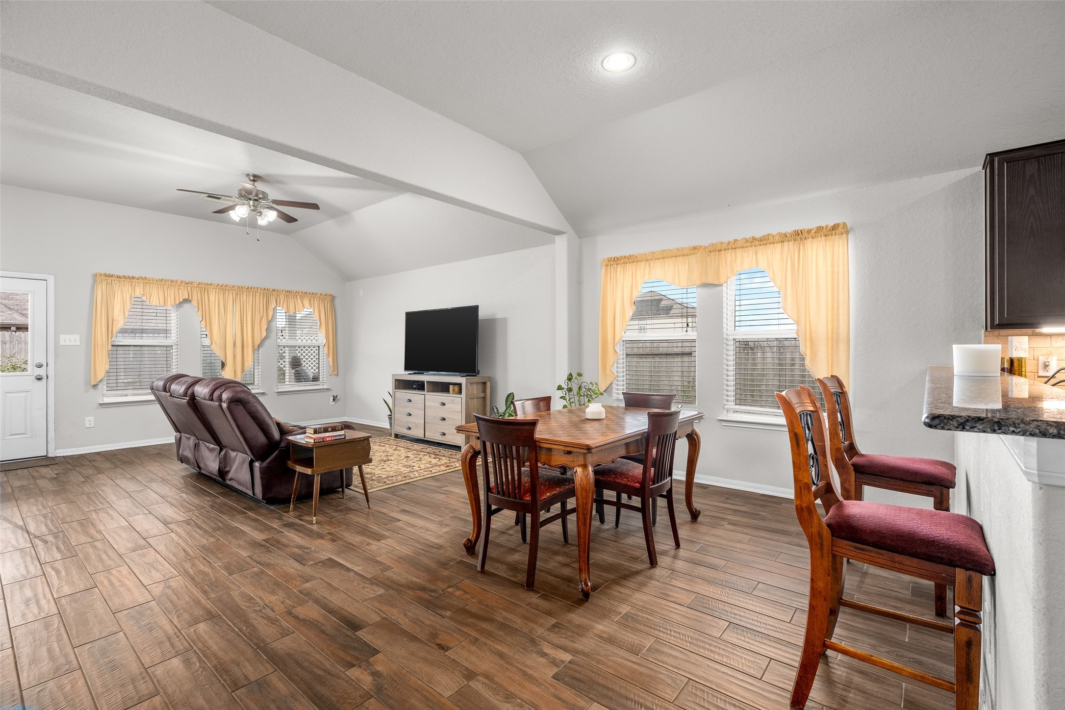 4518 Antero Court Rosenberg, TX 77471 - Photo 23 of 33 a living room with furniture a fireplace and a flat screen tv