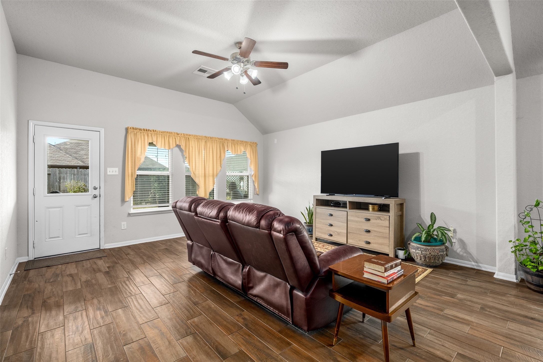 4518 Antero Court Rosenberg, TX 77471 - Photo 24 of 33 a living room with furniture and a flat screen tv