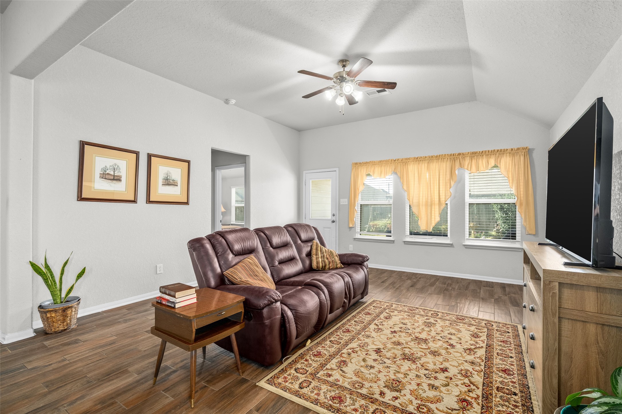 4518 Antero Court Rosenberg, TX 77471 - Photo 25 of 33 a living room with furniture and a flat screen tv
