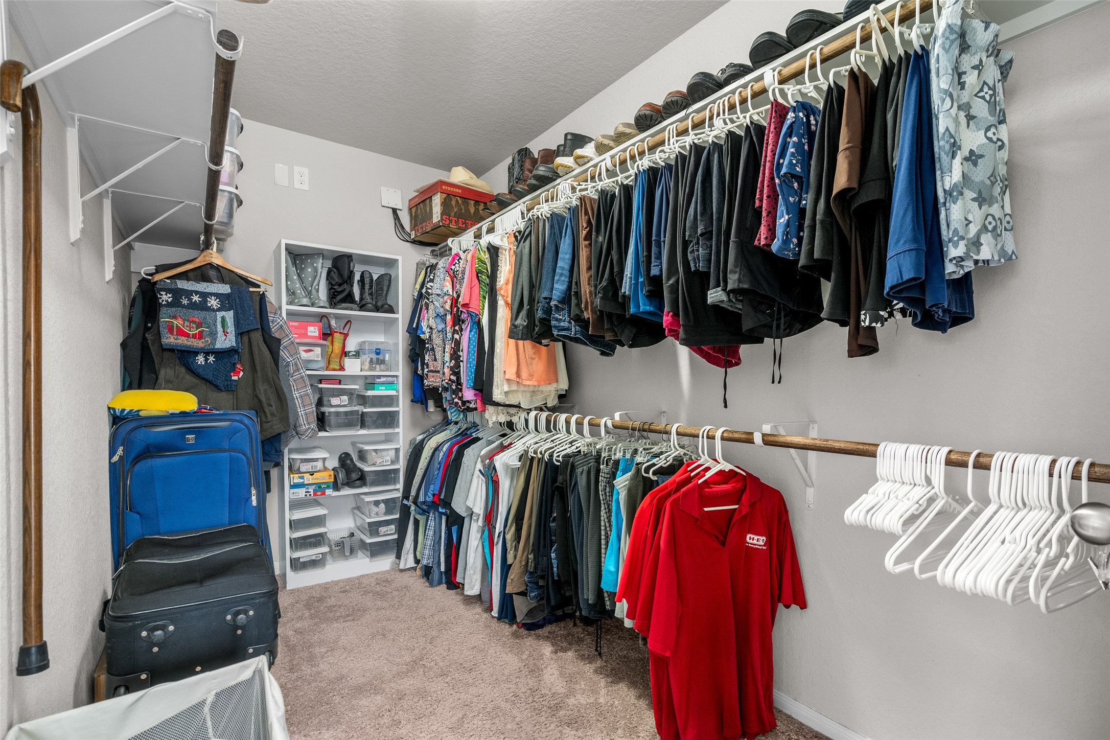 4518 Antero Court Rosenberg, TX 77471 - Photo 26 of 33 a view of walk in closet with clothes and shoes