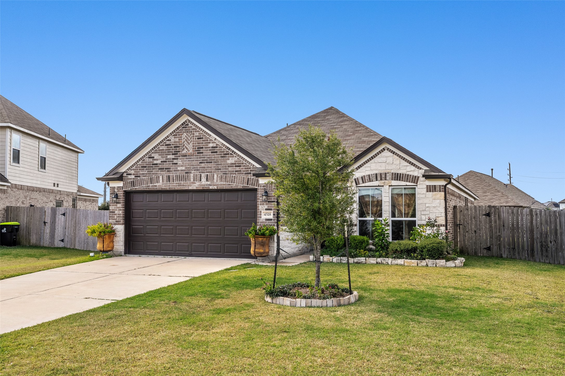 4518 Antero Court Rosenberg, TX 77471 - Photo 4 of 33 a front view of a house with a yard and garage