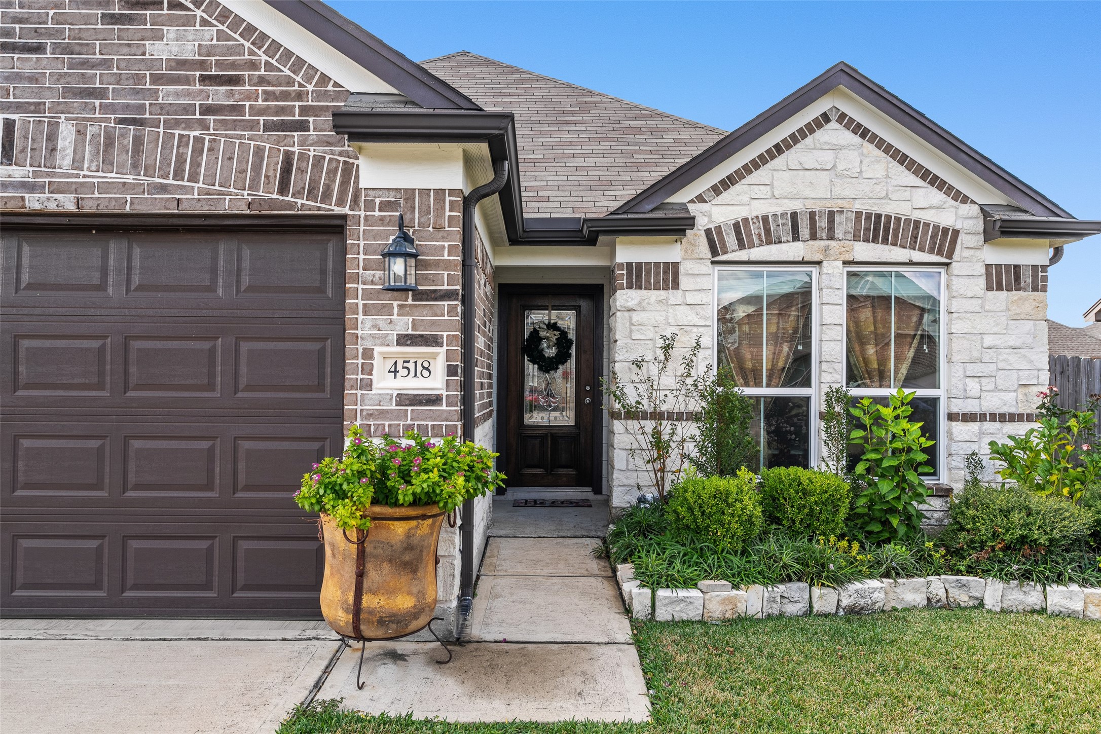 4518 Antero Court Rosenberg, TX 77471 - Photo 5 of 33 a front view of a house with potted plants