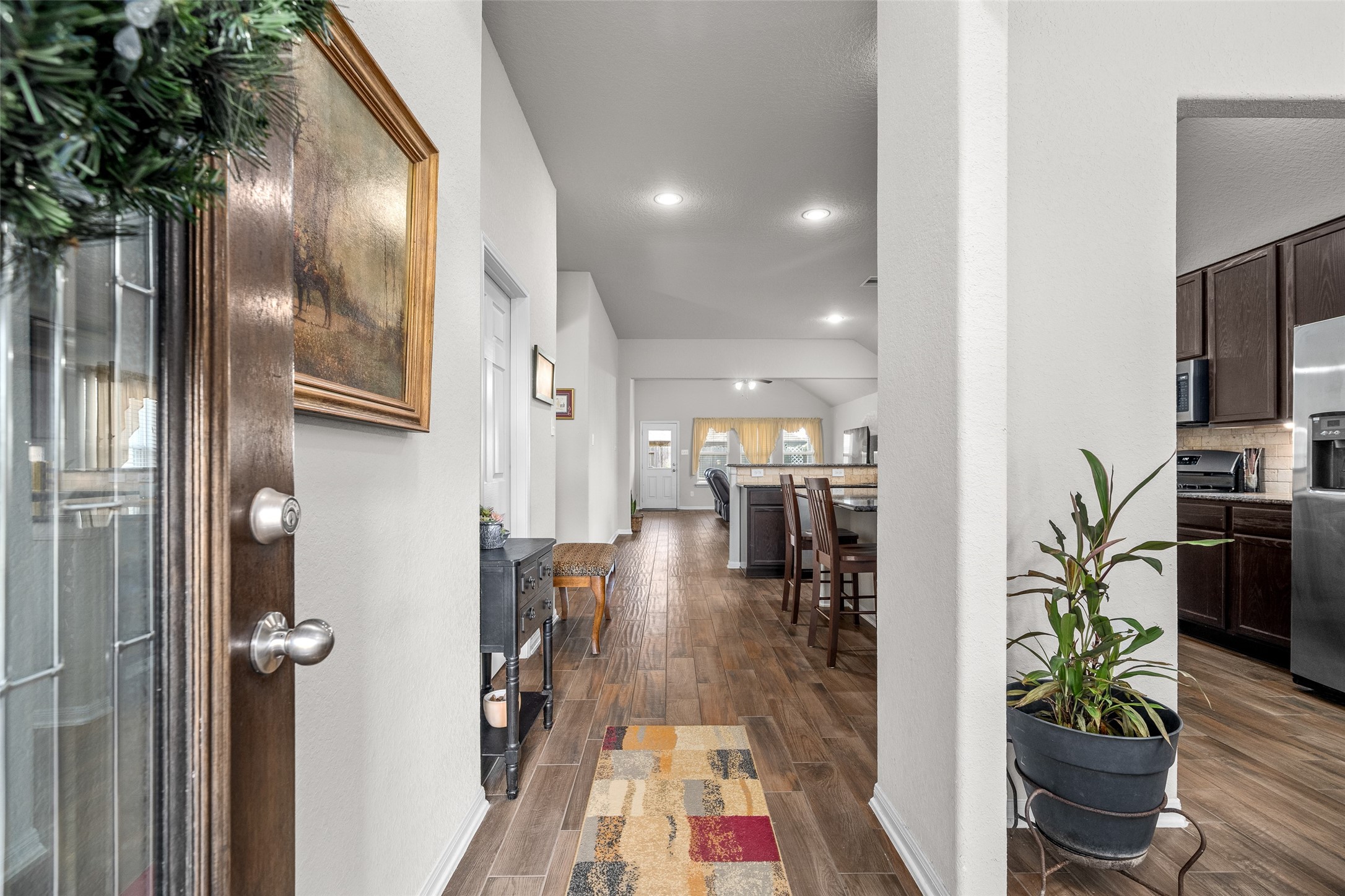 4518 Antero Court Rosenberg, TX 77471 - Photo 6 of 33 a hallway with a dining table and chairs