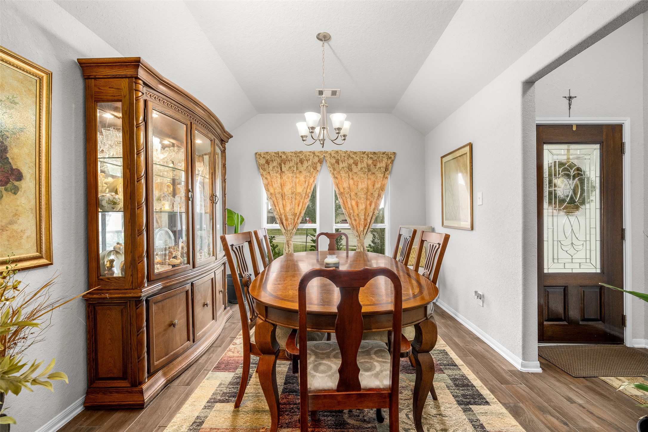 4518 Antero Court Rosenberg, TX 77471 - Photo 8 of 33 a view of a dining room with furniture a chandelier and wooden floor