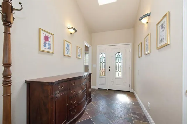 a view of a livingroom with furniture and closet