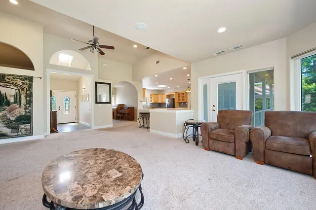 a kitchen with a stove sink and cabinets