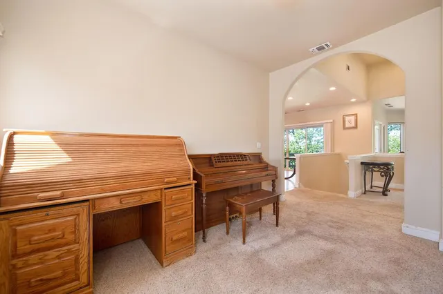 a view of a room with wooden floor and window
