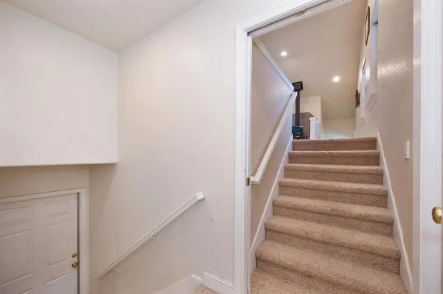 a bathroom with a tub and a window