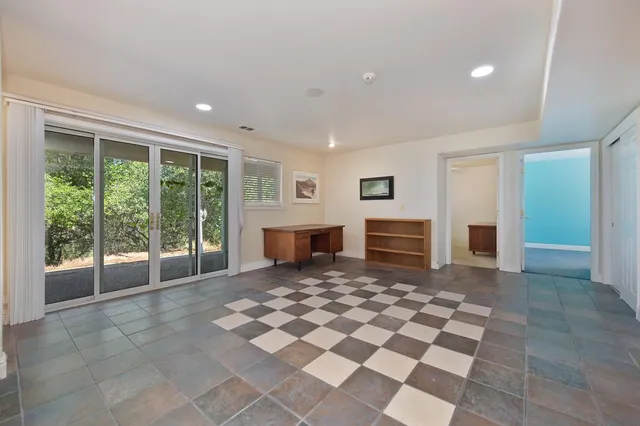 a view of a backyard with furniture