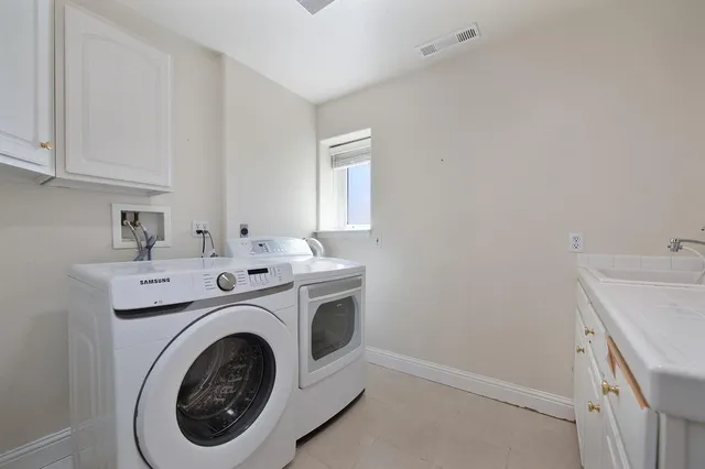 a view of a yard with plants and trees