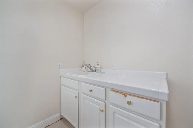 a view of a yard with a tree