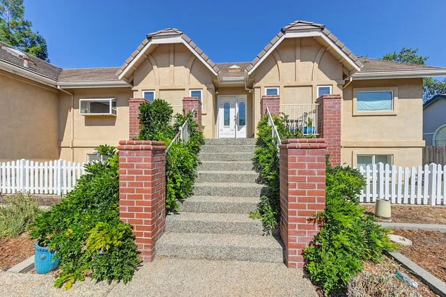 a view of a livingroom with furniture and a fireplace