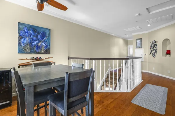 a view of a hallway with furniture