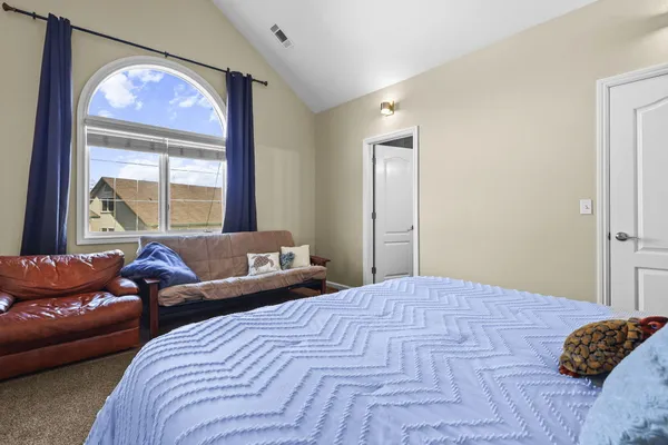 a bedroom with a bed and walk in closet