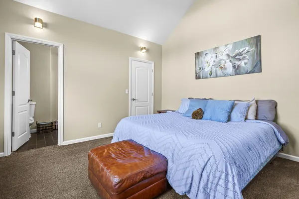 a bathroom with a toilet and a bath tub