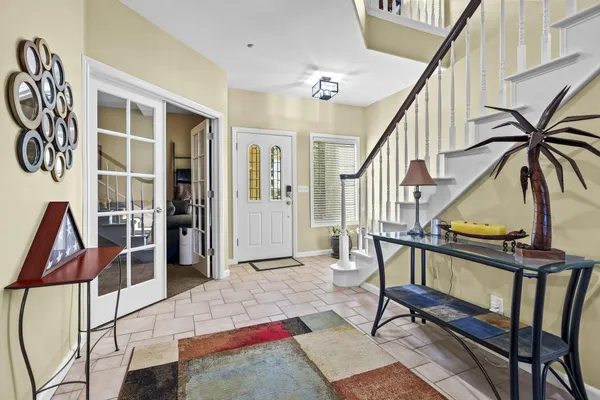 a view of an entryway with wooden floor and door