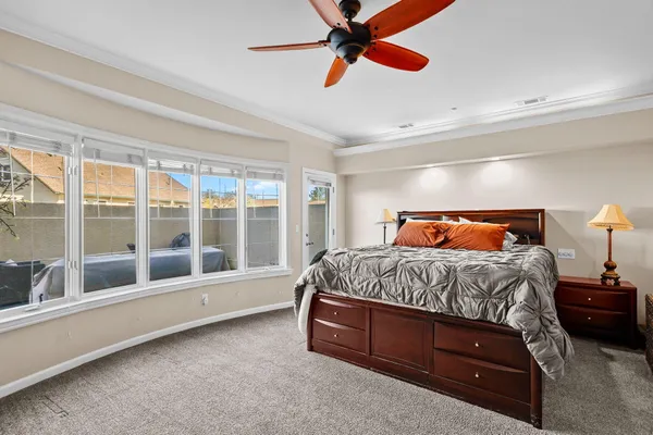 a bedroom with a bed and window
