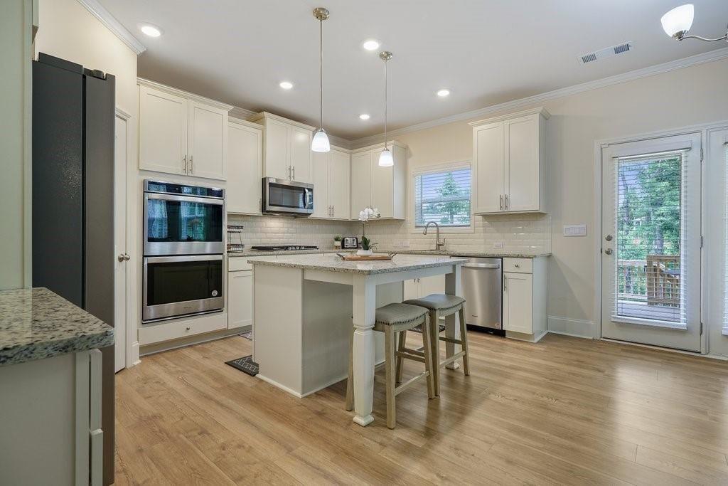 66 Snowdon Way Villa Rica, GA 30180 - Photo 13 of 52 a kitchen with a sink stainless steel appliances and cabinets