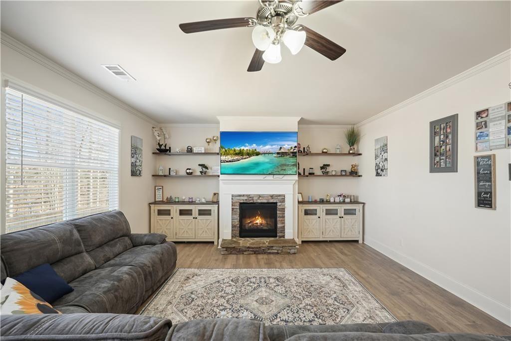 66 Snowdon Way Villa Rica, GA 30180 - Photo 19 of 52 a living room with furniture and a fireplace