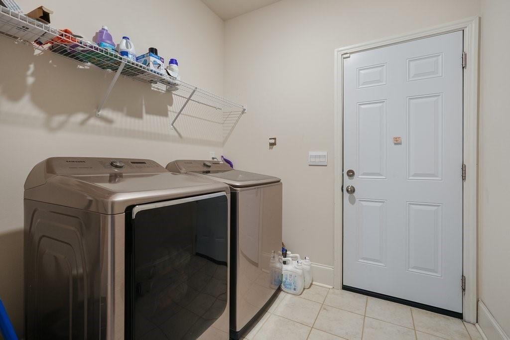 66 Snowdon Way Villa Rica, GA 30180 - Photo 22 of 52 a utility room with dryer and washer