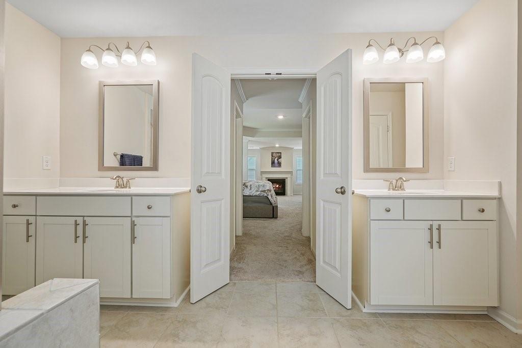 66 Snowdon Way Villa Rica, GA 30180 - Photo 41 of 52 a bathroom with a sink vanity and mirror