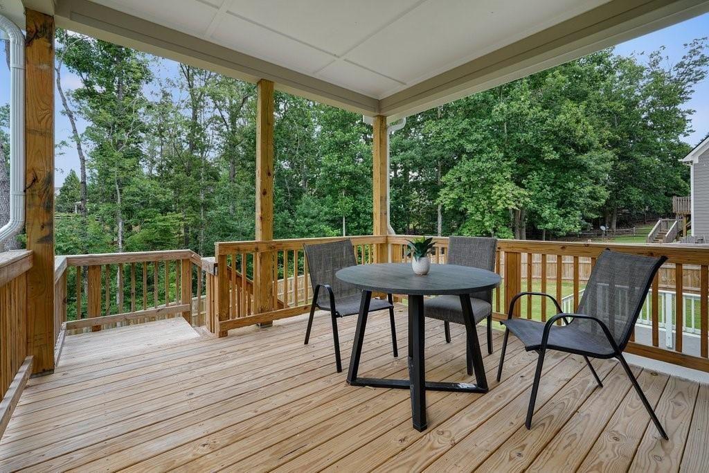 66 Snowdon Way Villa Rica, GA 30180 - Photo 45 of 52 a view of a deck with wooden floor and outdoor seating