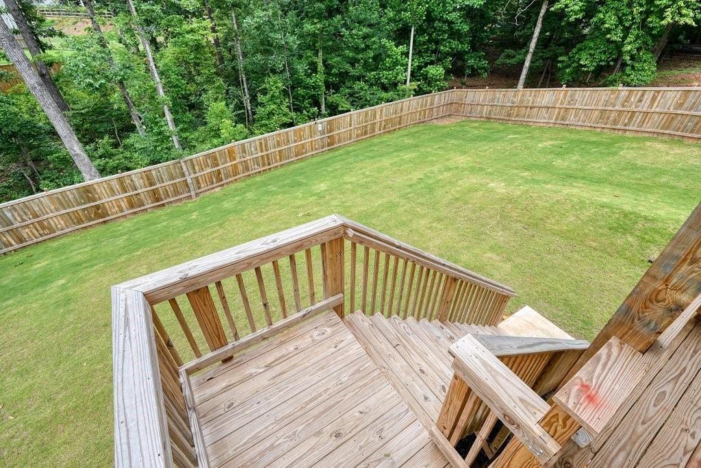 66 Snowdon Way Villa Rica, GA 30180 - Photo 48 of 52 a view of balcony with wooden floor and fence