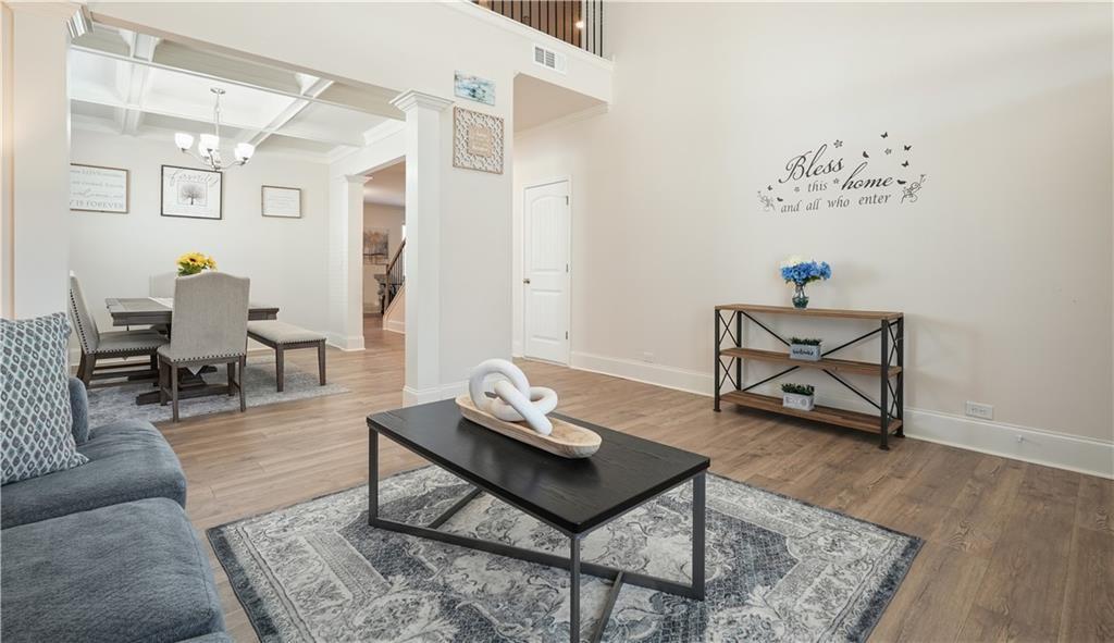 66 Snowdon Way Villa Rica, GA 30180 - Photo 8 of 52 a living room with furniture and wooden floor