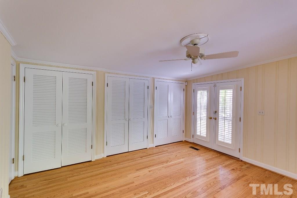 5401 Couch Mountain Road Durham, NC 27705 - Photo 15 of 25 The master bedroom is a vacation worthy retreat. With his and hers and hers triple closets for ample in-suite storage, and double doors to a private side deck, this is your private retreat, every day.