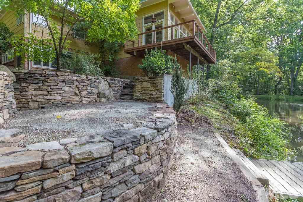 5401 Couch Mountain Road Durham, NC 27705 - Photo 24 of 25 Beautiful stacked stone retaining wall, patio and steps down to the dock are just some of the outdoor features of this exquisite property.