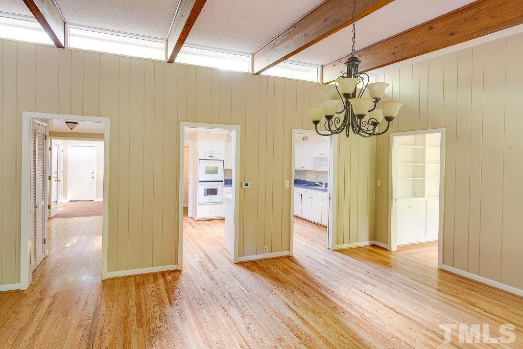 5401 Couch Mountain Road Durham, NC 27705 - Photo 10 of 25 The reverse angle of the dining area shows the two pocket doorways to the kitchen center, the doorway to the main hall on left, and the pocket doorway to the master suite sunroom on right.