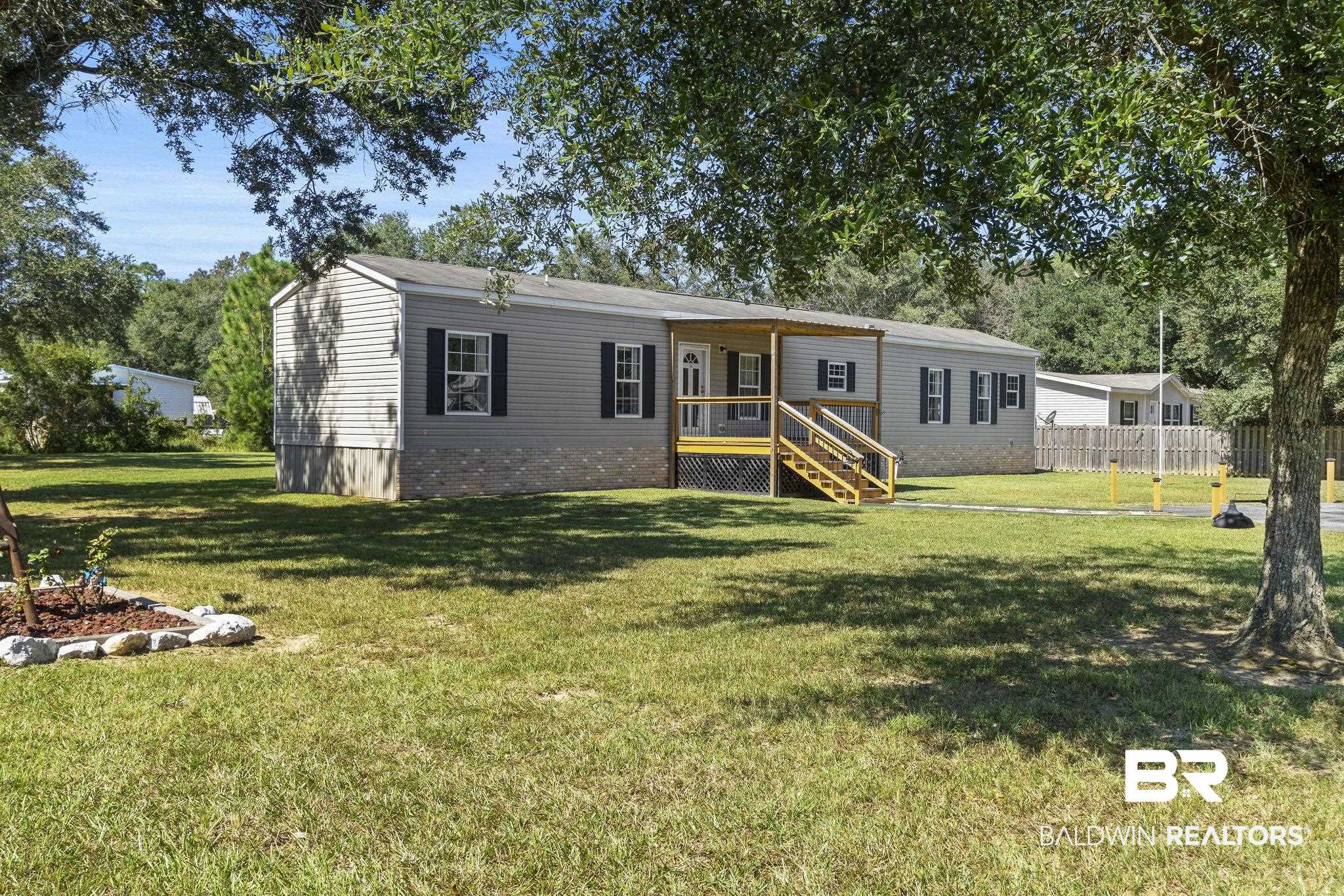 6870 Cecilia Court Theodore, AL 36582 - Photo 1 of 83 Manufactured / mobile home featuring a front yard