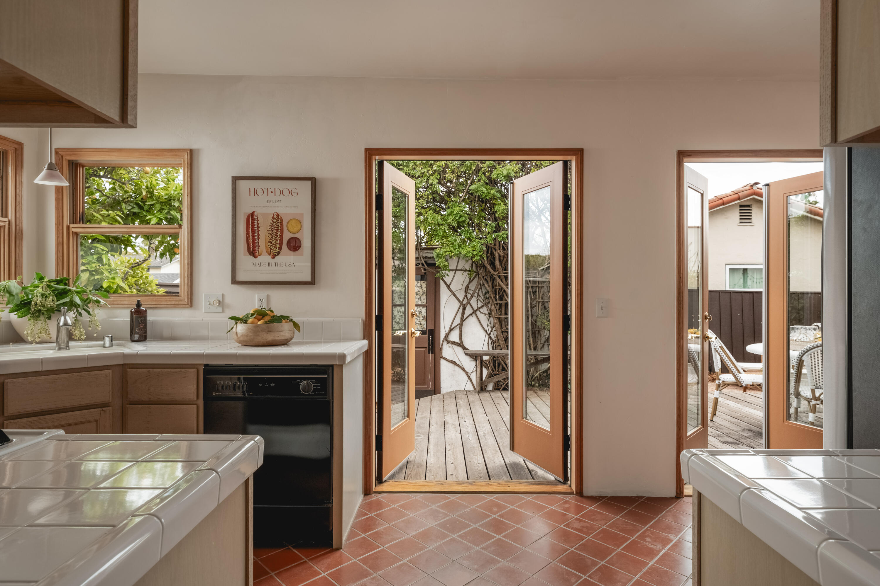 115 West Junipero Street Santa Barbara, CA 93105 - Photo 11 of 30 a kitchen with stainless steel appliances granite countertop a refrigerator and a sink
