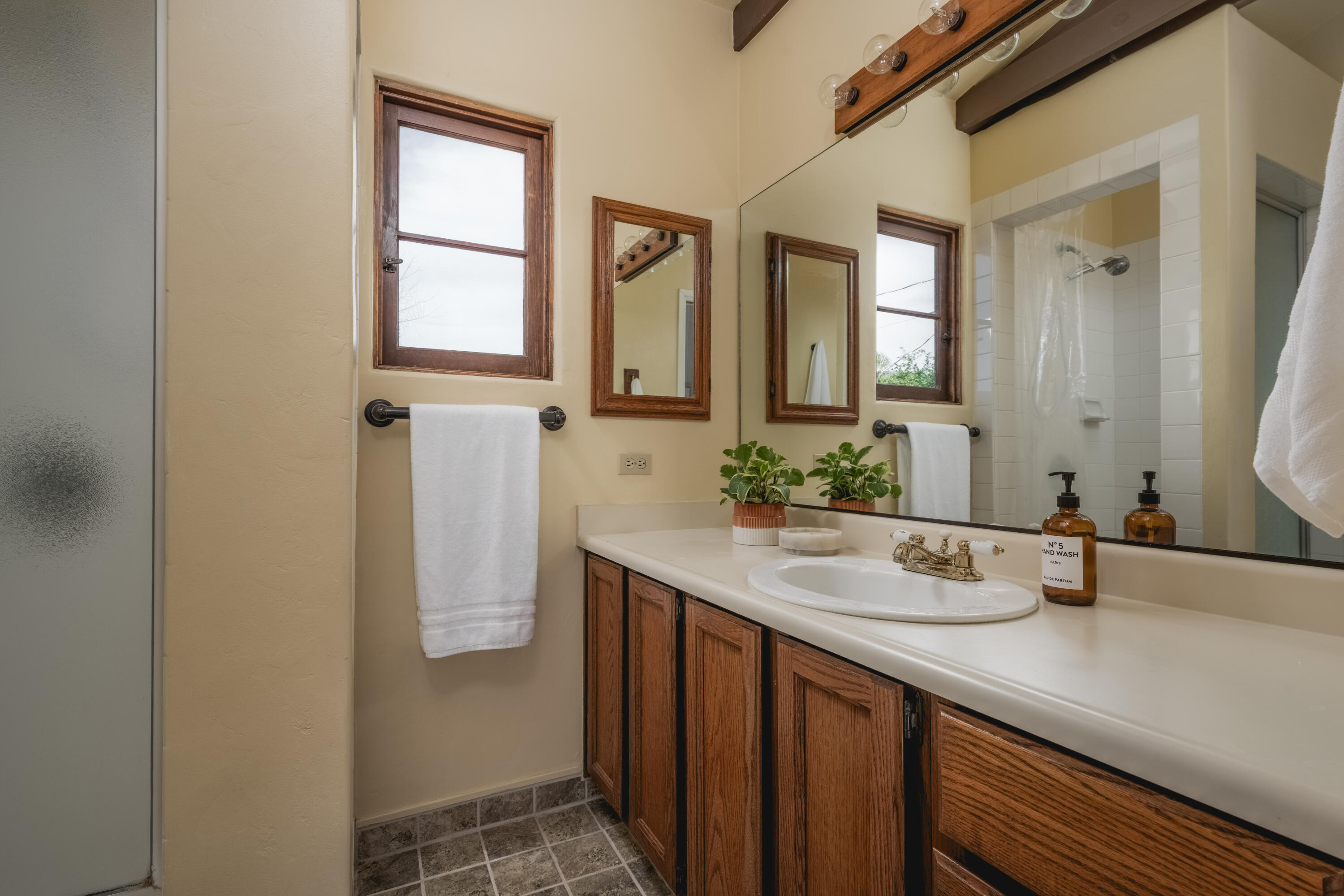 115 West Junipero Street Santa Barbara, CA 93105 - Photo 20 of 30 a bathroom with a sink and a mirror