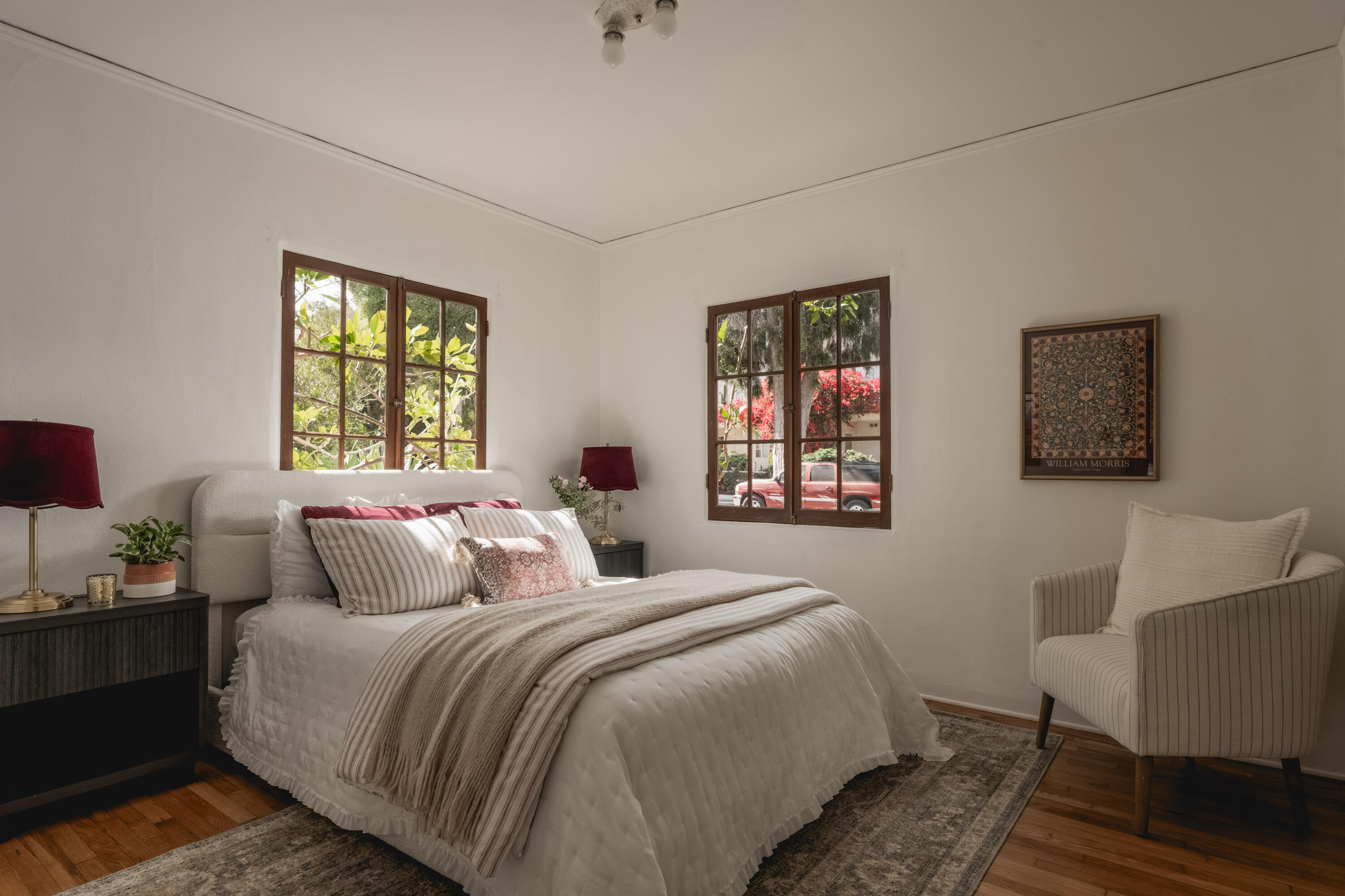 115 West Junipero Street Santa Barbara, CA 93105 - Photo 21 of 30 a bedroom with a bed and wooden floor