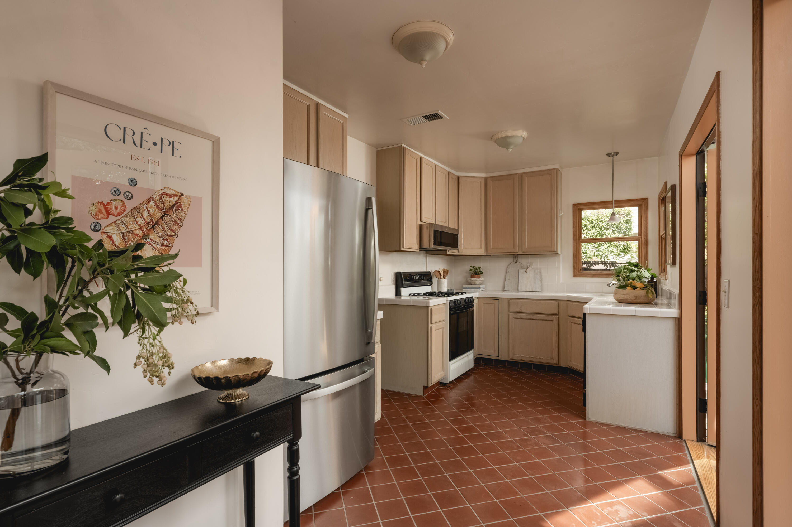115 West Junipero Street Santa Barbara, CA 93105 - Photo 9 of 30 a kitchen with a refrigerator and a sink