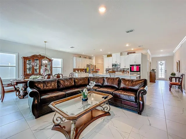 a living room with furniture and a window