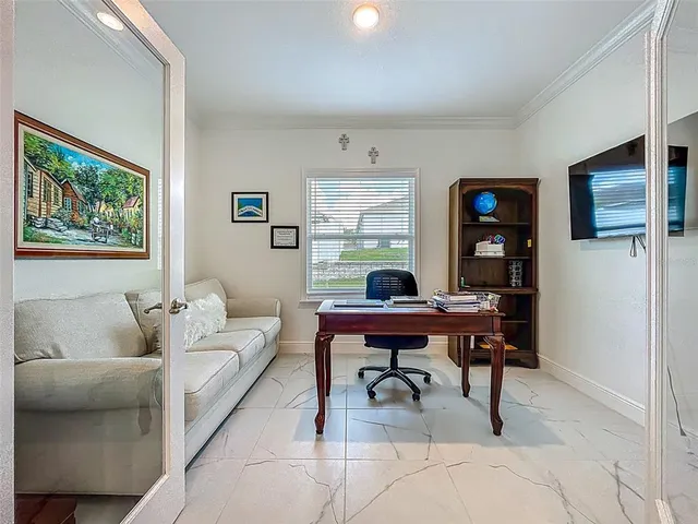 a living room with furniture and a table