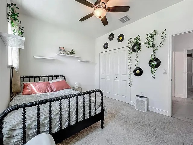 a bedroom with a bed and window