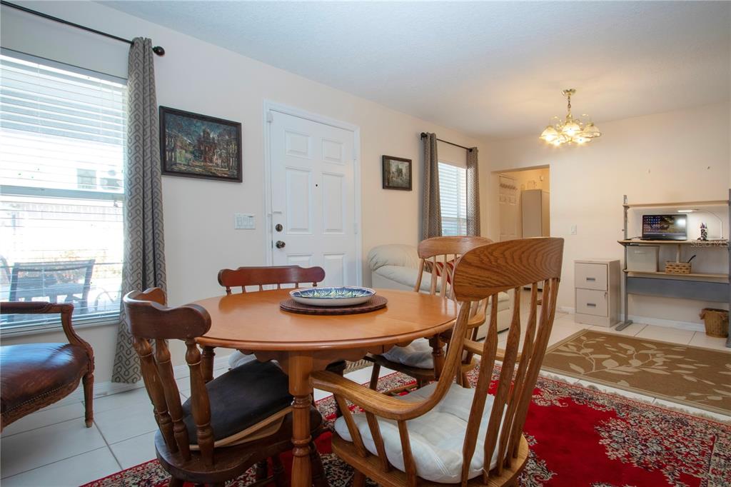 4010 North Lockwood Ridge Road Sarasota, FL 34235 - Photo 20 of 64 a view of a dining room with furniture