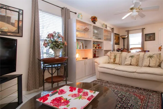 a bedroom with a bed and a lamp on dresser