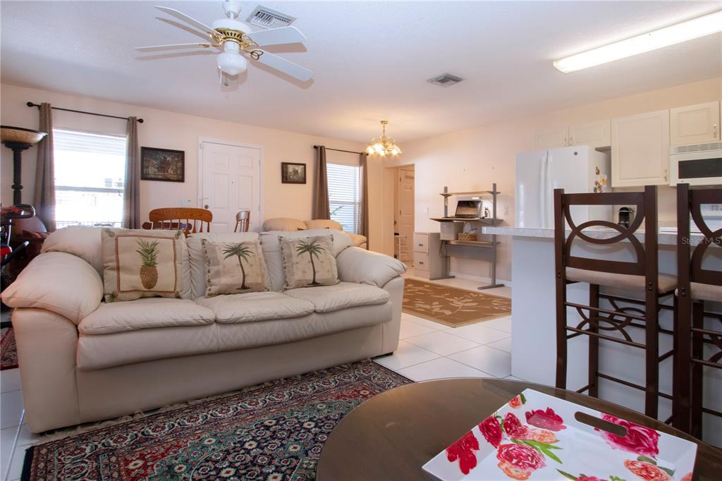 4010 North Lockwood Ridge Road Sarasota, FL 34235 - Photo 33 of 64 a living room with furniture and wooden floor